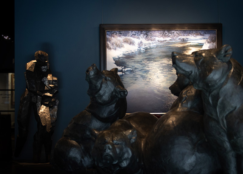 An image of shimmer, the largest painting in the exhibition, flanked by a Dan Ostermiller sculpture.